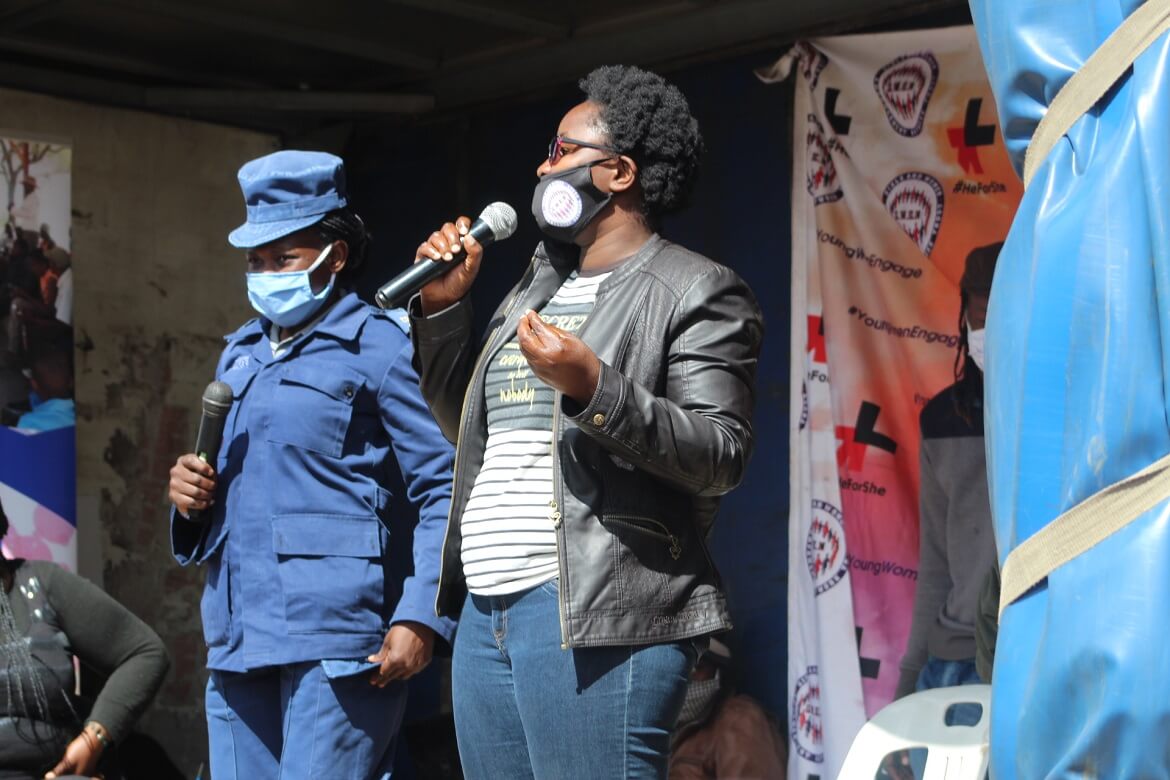 GWEN TRUST team member speaking during a community engagement activity
